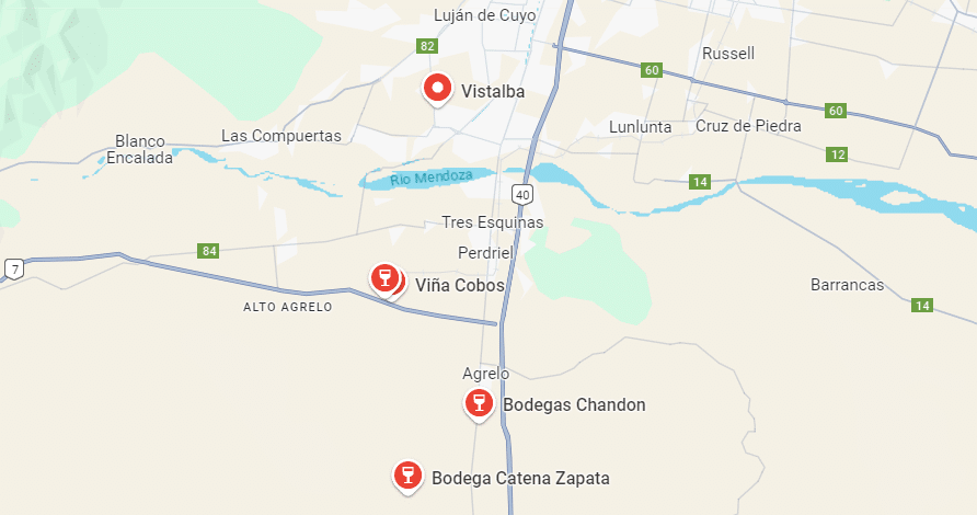 Mapa mostrando a região de Mendoza, na Argentina, com destaque para várias vinícolas. As vinícolas Viña Cobos, Bodega Chandon, Vistalba e Ruca Malen e Bodega Catena Zapata estão marcadas com ícones de taças de vinho, localizadas próximas à estrada principal.